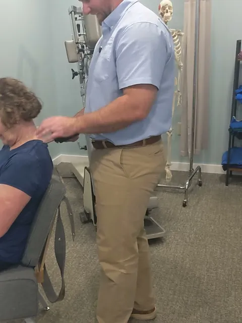Dr. Tokar performing a chiropractic adjustment on a patient at Cross Chiropractic